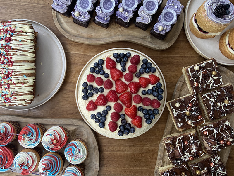 a selection of cakes, cup cakes and caramel shortbread